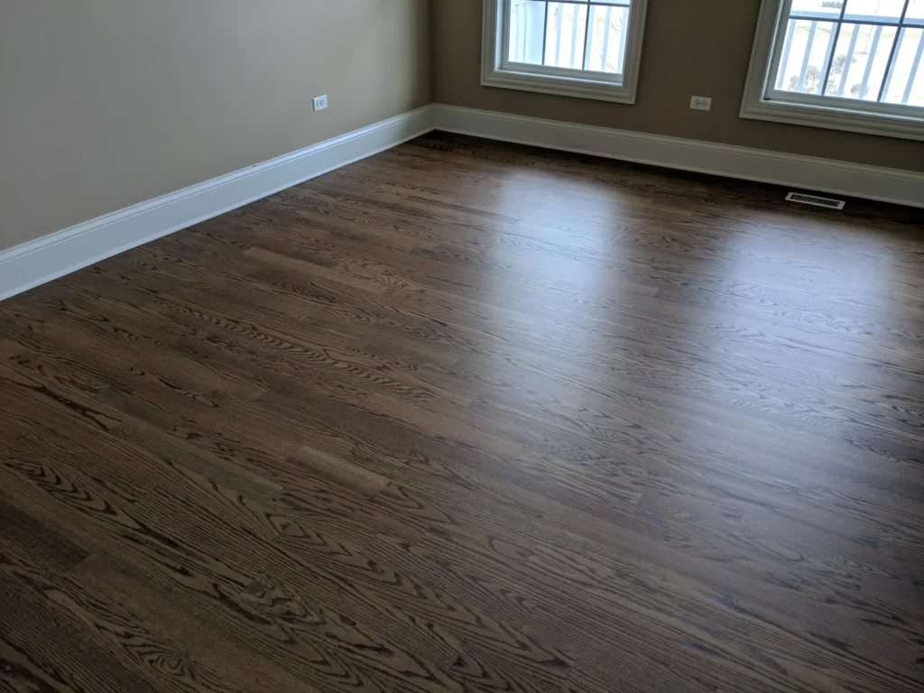 Dark hardwood floor in a room shown by CMS Floors