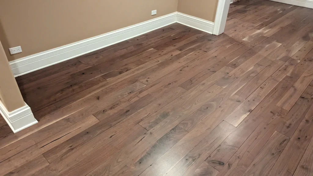 Wood floor at a room threshold from the CMS Floors gallery