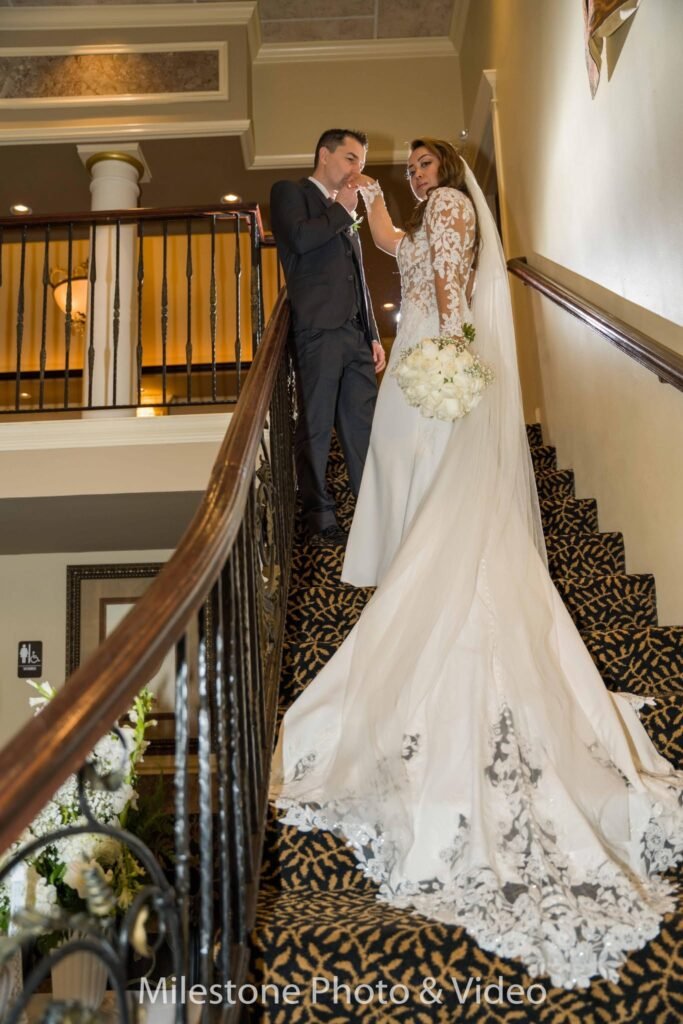 Wedding couple on the interior staircase; Cotillion Banquets gallery