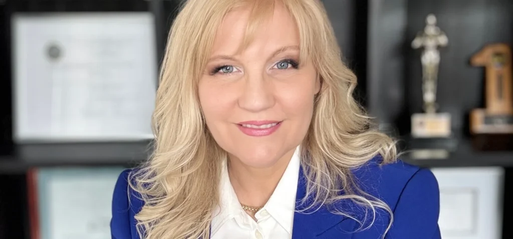 Diana Wojcik Dobrzycki in a blue jacket at an office
