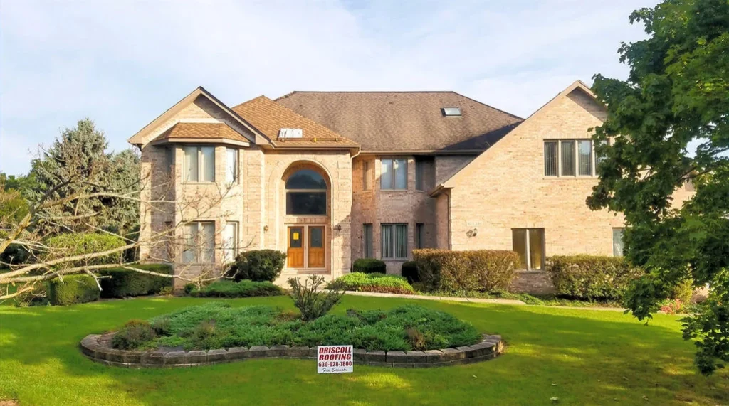 Driscoll Roofing — residential roof brick house