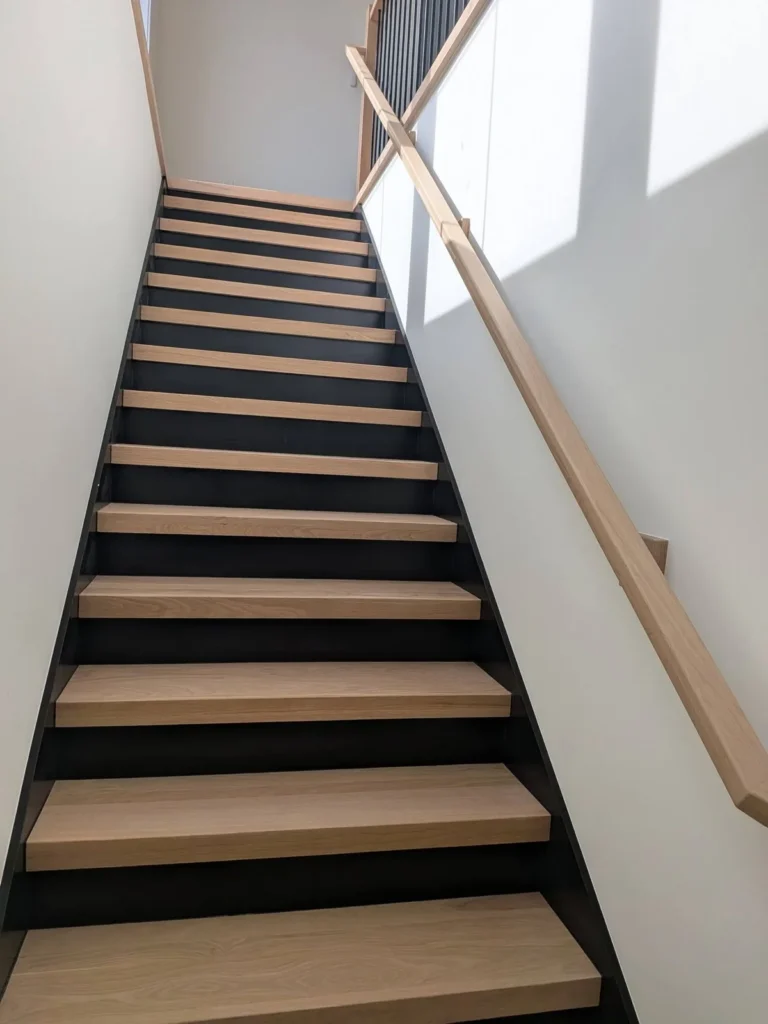Oak stairs black risers in the DS Superior Hardwood Flooring gallery