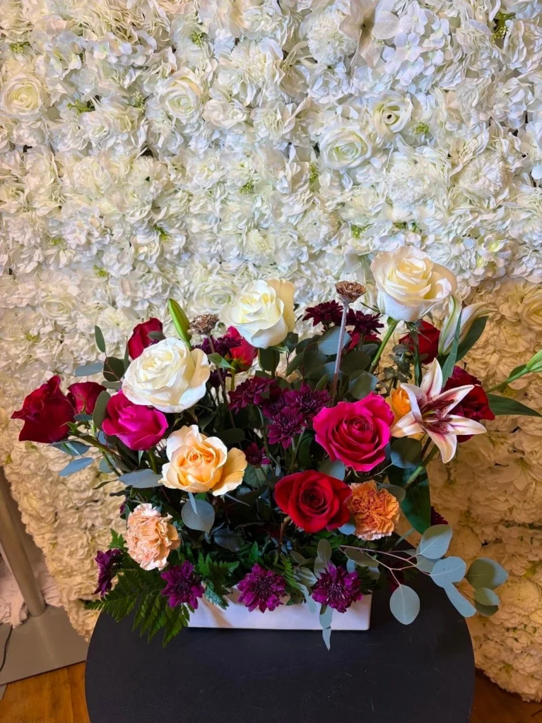 Floral centerpiece display shown by Fiesta Party Rental