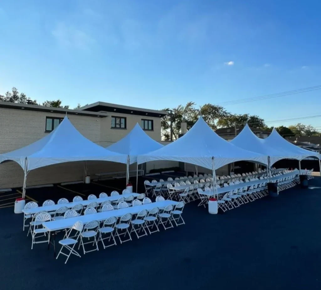 Outdoor tent and folding chair layout shown by Fiesta Party Rental
