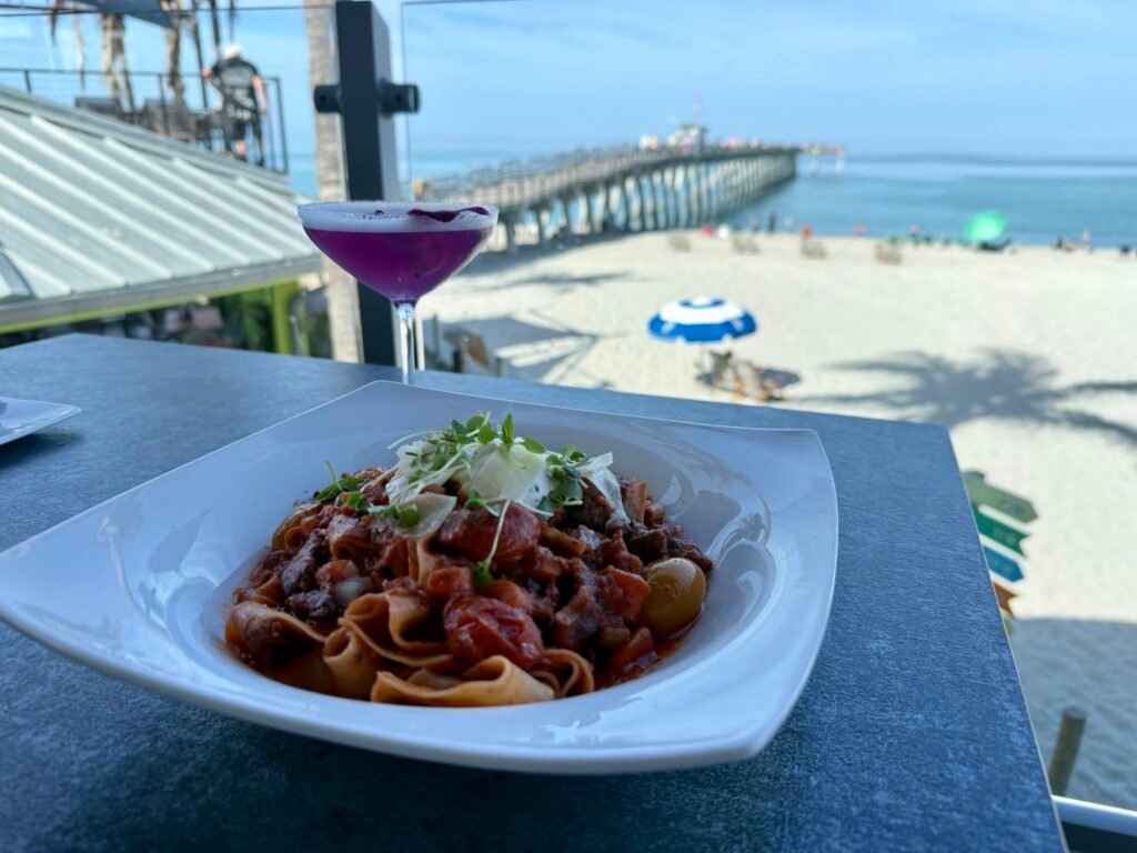 Pasta and a purple cocktail beside Venice Fishing Pier; Fins at Sharky's gallery
