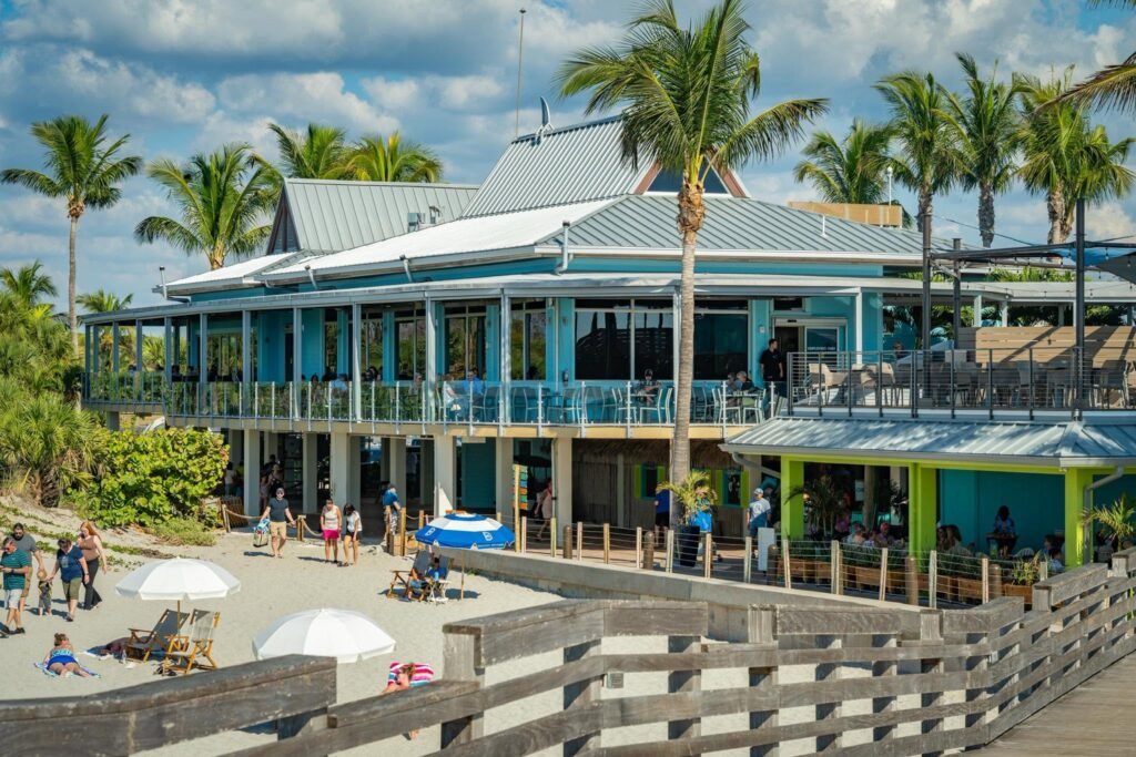 Beachside restaurant exterior with palm trees; Fins at Sharky's gallery