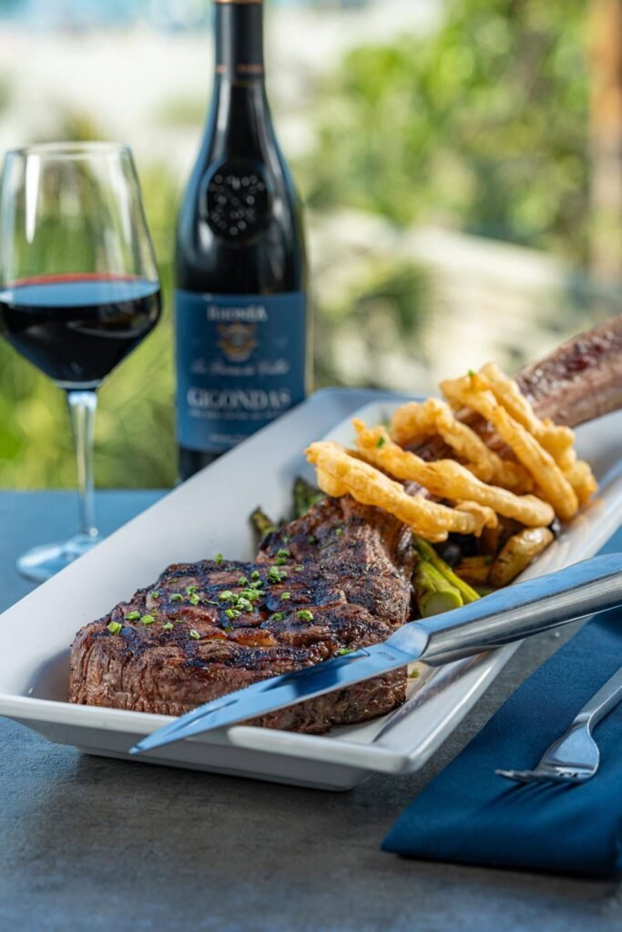 Steak and fries served with red wine; Fins at Sharky's gallery
