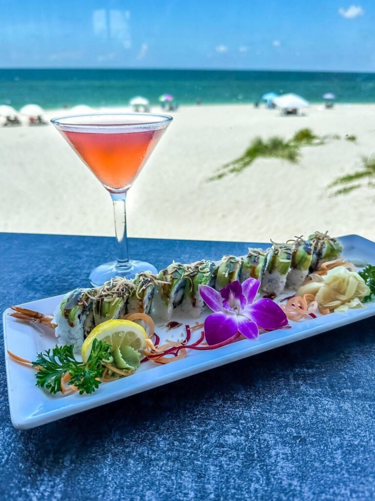 Sushi platter and cocktail overlooking the beach; Fins at Sharky's gallery