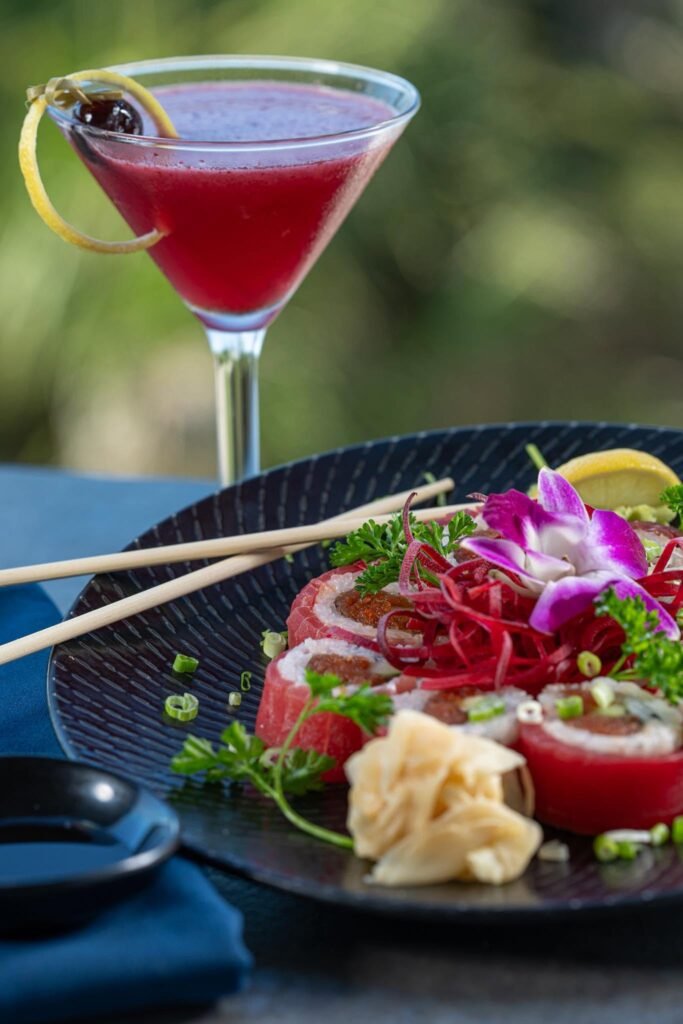 Sushi and a red cocktail on a dark platter; Fins at Sharky's gallery