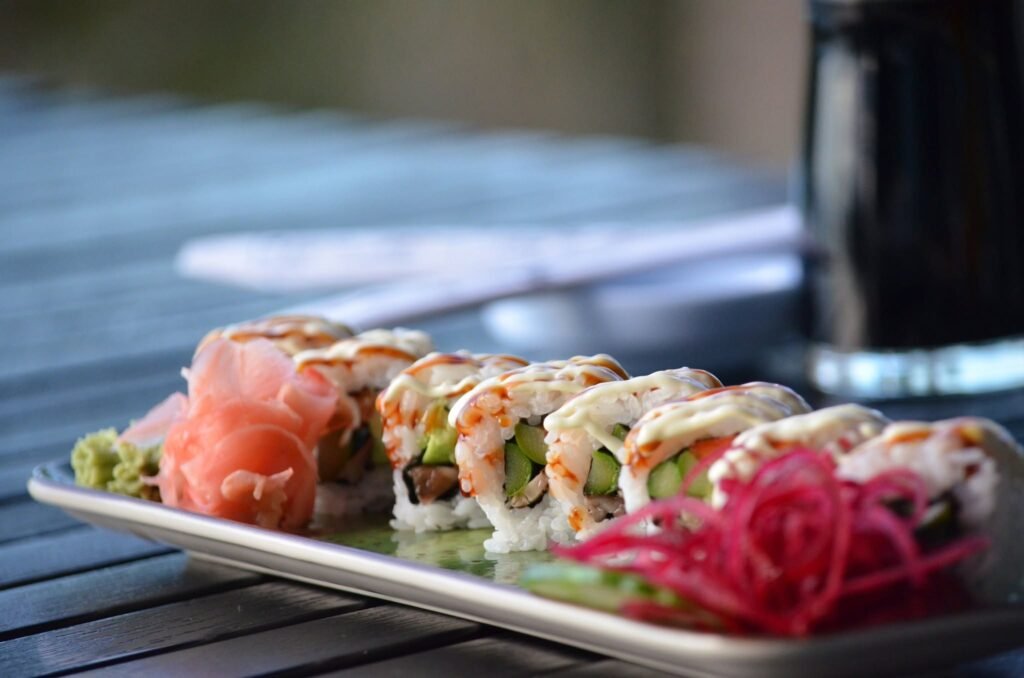 Sushi rolls with pickled ginger and colorful garnish; Fins at Sharky's gallery