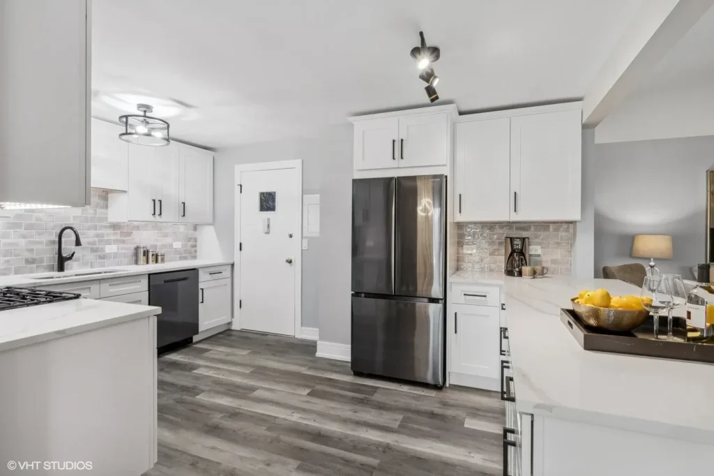 White kitchen dark counter in the Home One gallery
