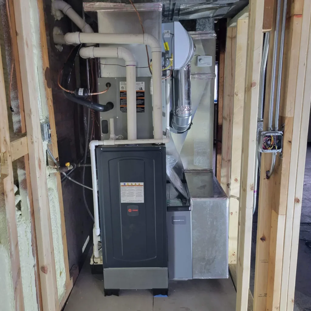 Furnace with connected piping and ductwork shown by Mr. Heating and Cooling