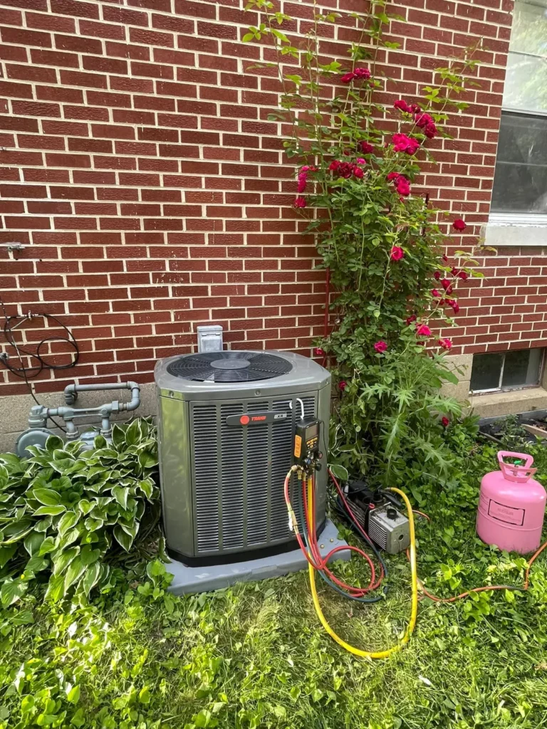 Outdoor air conditioning unit beside a brick house shown by Mr. Heating and Cooling