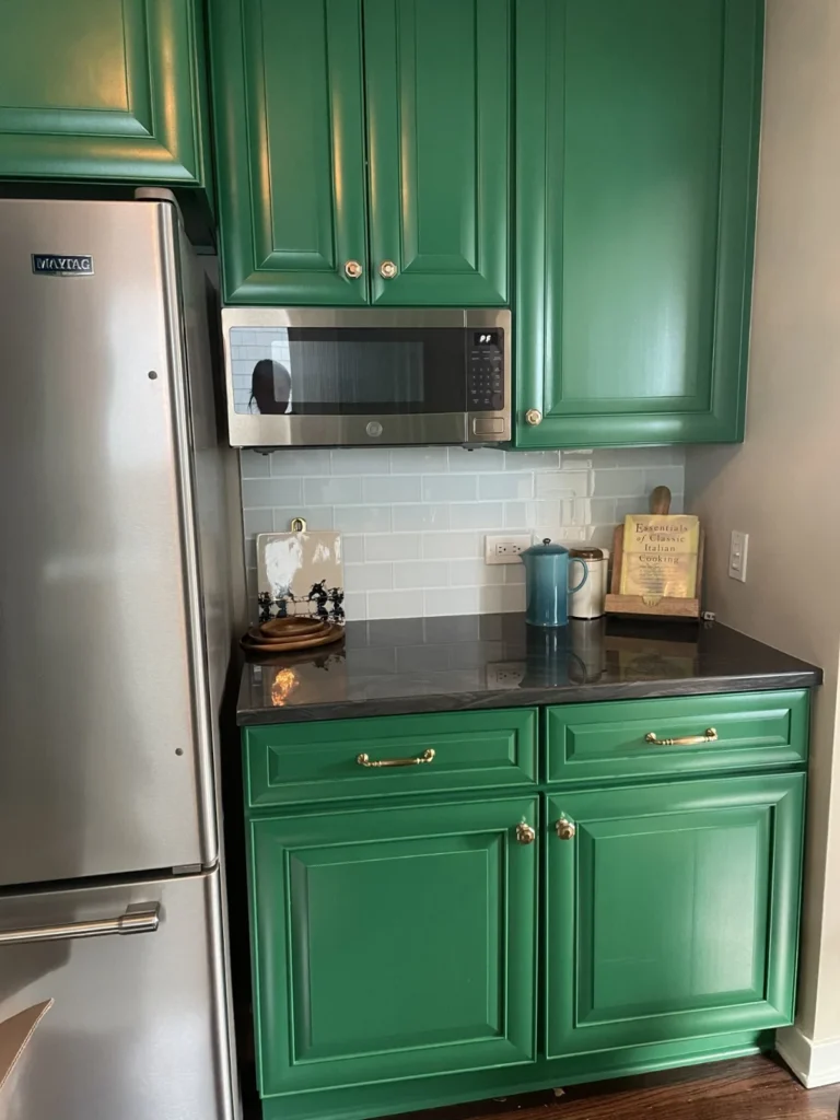 Patriot Moving source photograph of a cleared counter and green kitchen cabinets