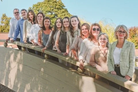 Psychological Counseling Center team together beside a lake
