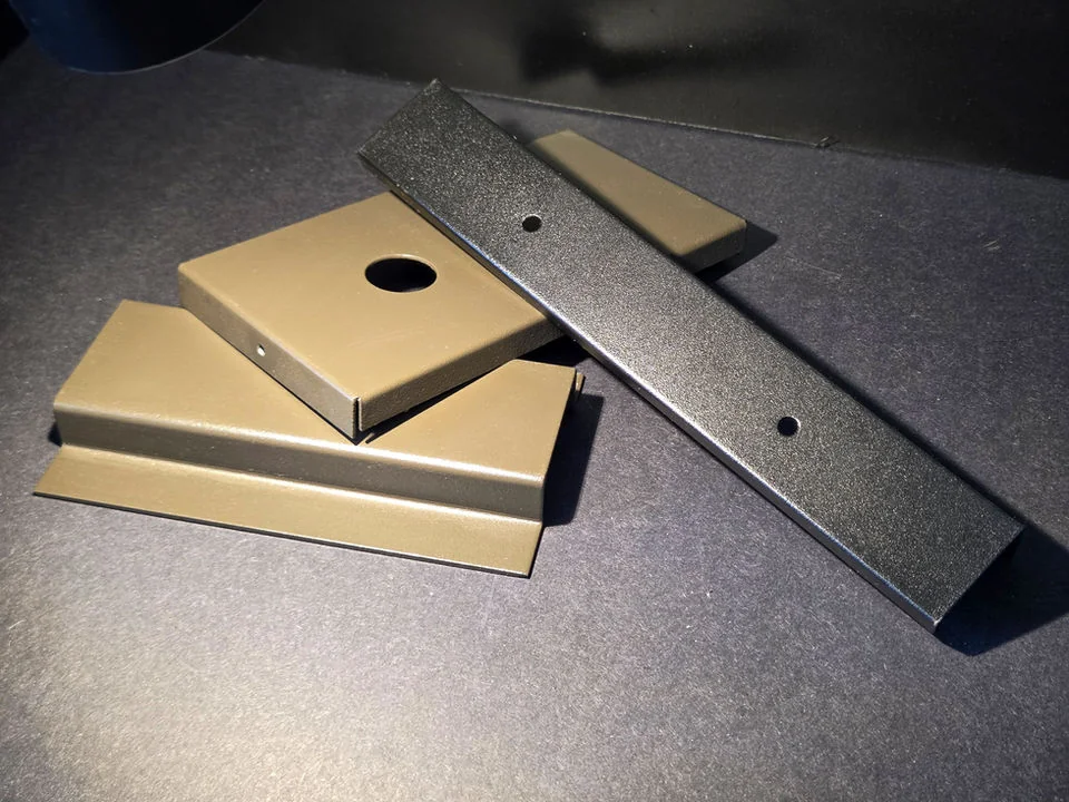 Coated and formed sheet metal components from Quad-Metal Company