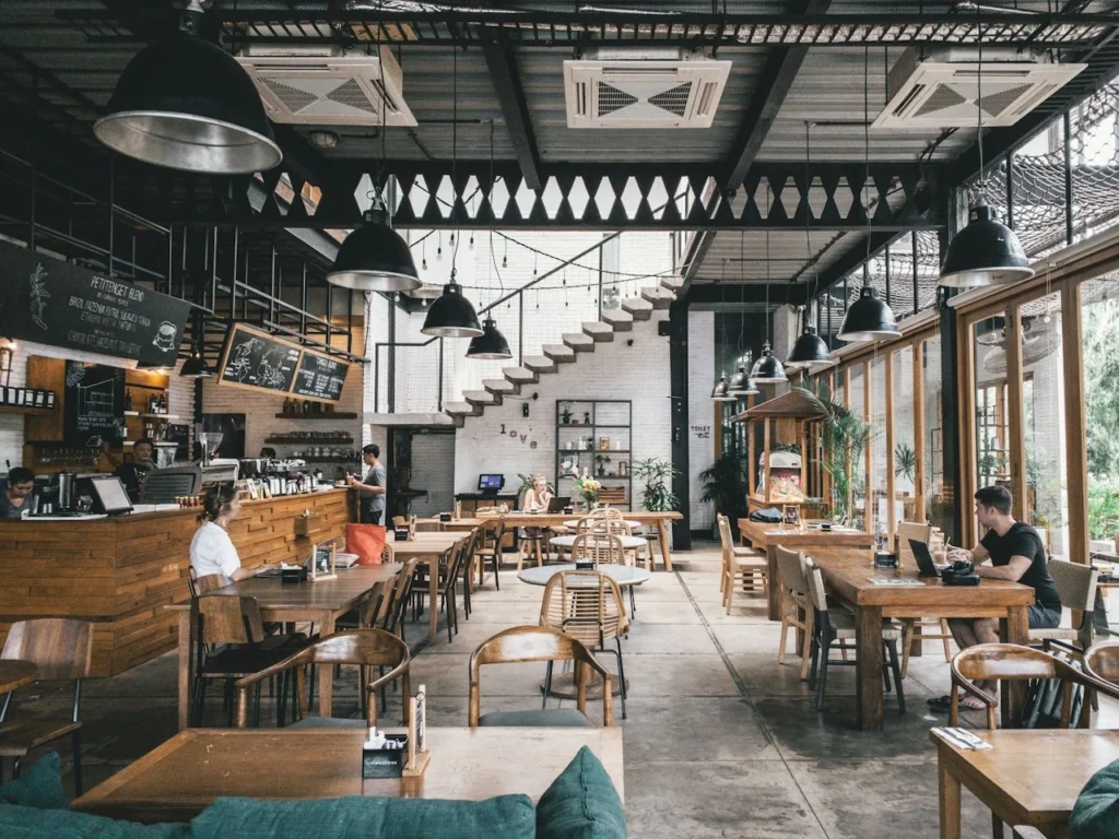 Restaurant interior with wooden tables and high ceilings