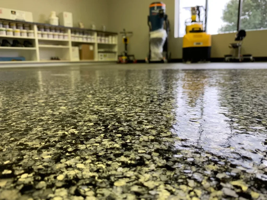 Gold flake floor closeup in the Royal Epoxy Coating gallery
