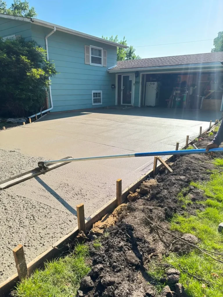 Fresh concrete driveway beside a house during a Salor project in Hanover Park