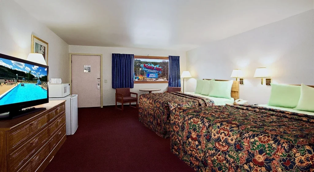 Shamrock Motel guest room with two beds viewed toward the entrance