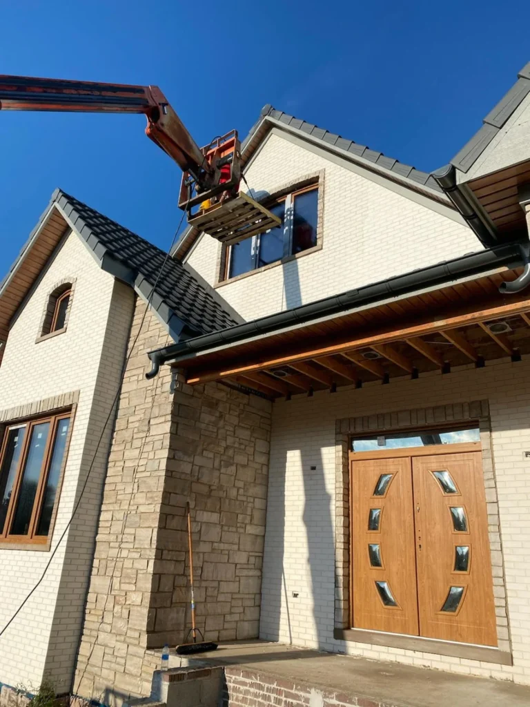 Raised work platform beside a house gable