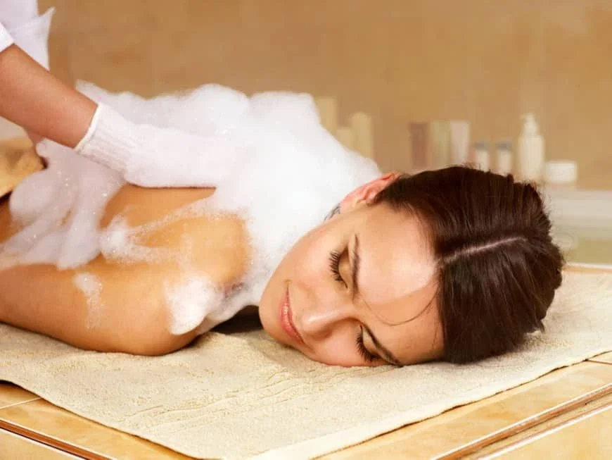 Close-up promotional image of a spa foam treatment
