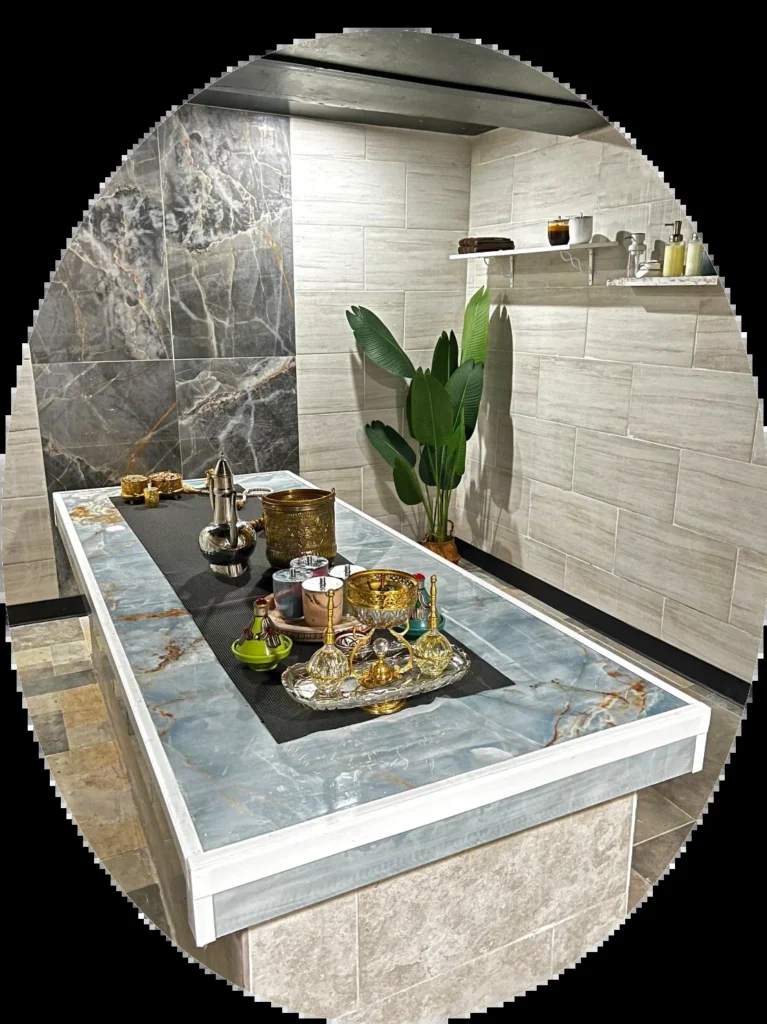 Stone treatment table framed by an arch-shaped crop