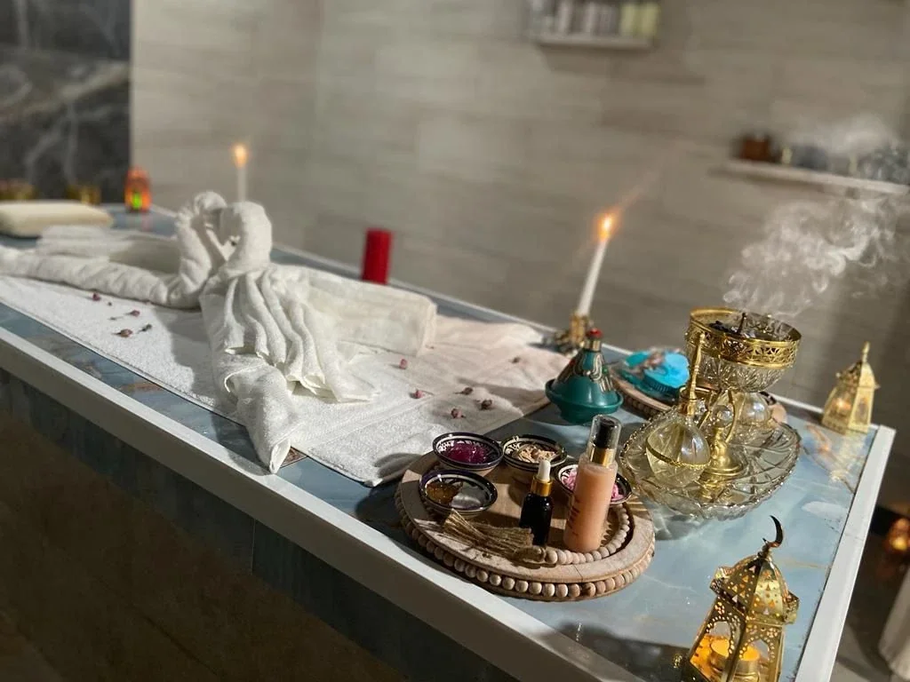 Tea tray beside a steaming stone spa table