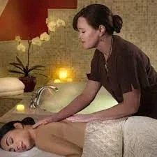 Small promotional image of a therapist giving a massage