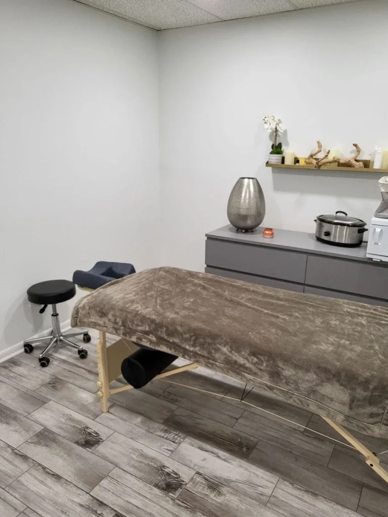Treatment table with a wall shelf and supplies