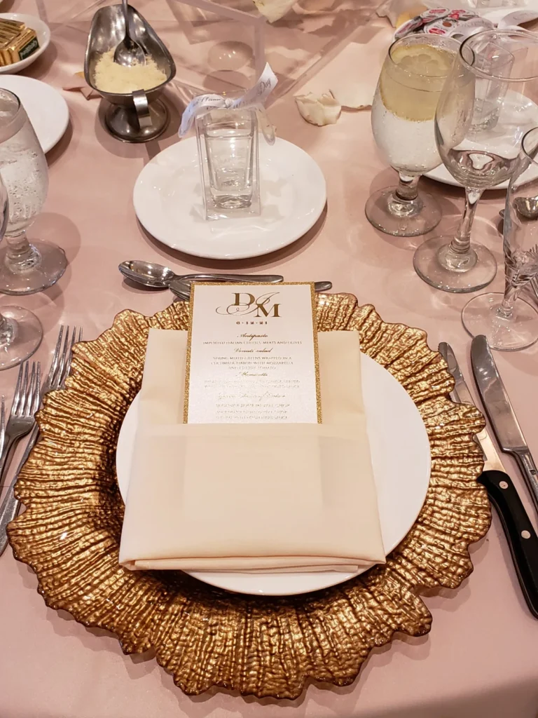 Gold charger place setting shown in the Venuti’s in Addison gallery