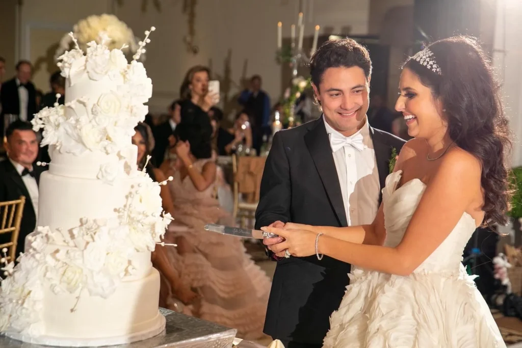 Wedding cake cutting shown in the Venuti’s in Addison gallery